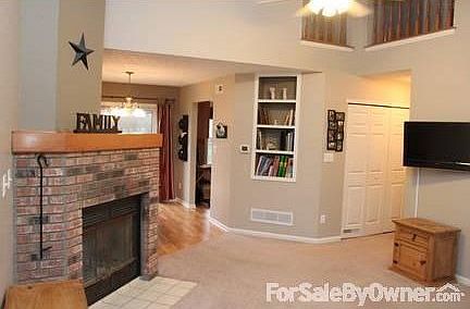 View from Living room
						:
						Fire place, built in bookshelves, vaulted ceilings, open to the dining room.