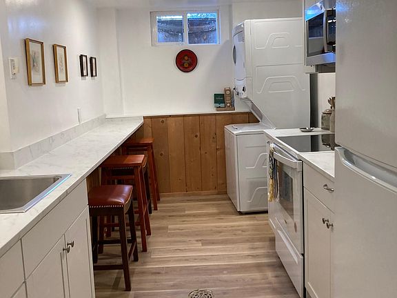 Full Kitchen with washer and Dryer and eat in space.