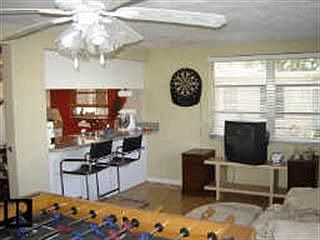 Florida room with breakfast bar into kitchen
