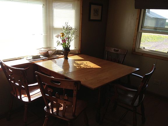Eat-in kitchen with bay windows.