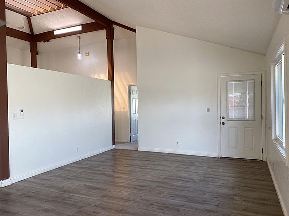 View of the living area looking back to the front door.