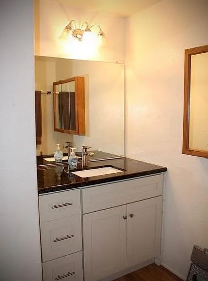 Remodeled downstairs bathroom/powder room, new granite counter tops and new cabinet. Additional storage in this room.