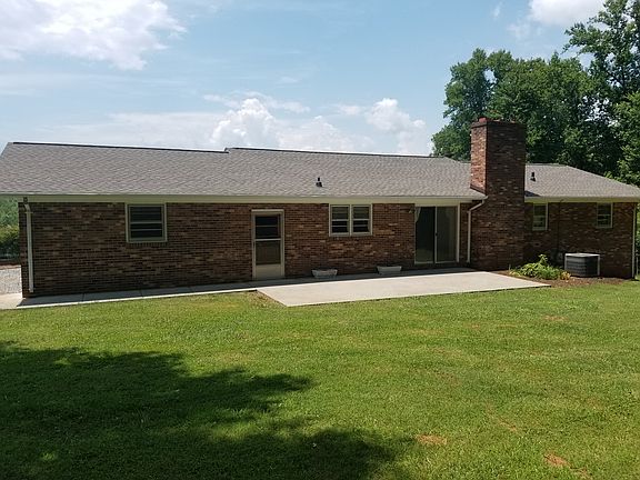 Back, nice concrete patio.