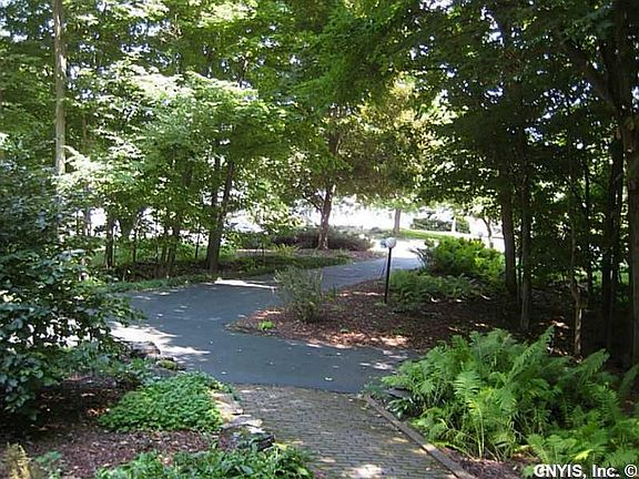 Yard. From front porch looking toward road. Charming landscaping.