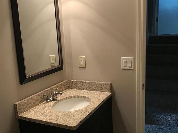 New Granite tops, cabinetry, lighting, flooring in bathrooms