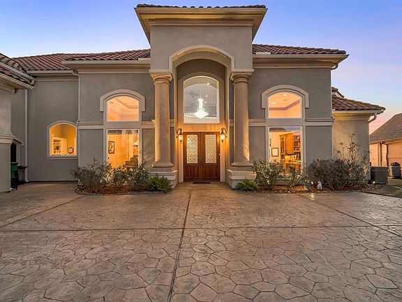 Upgraded details everywhere; stamped concrete driveway; tile roof; statement 2 story front porch.