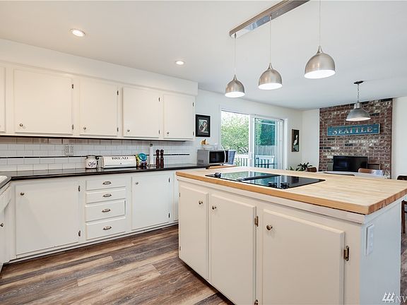 Spacious kitchen on the main floor connects to dining room
