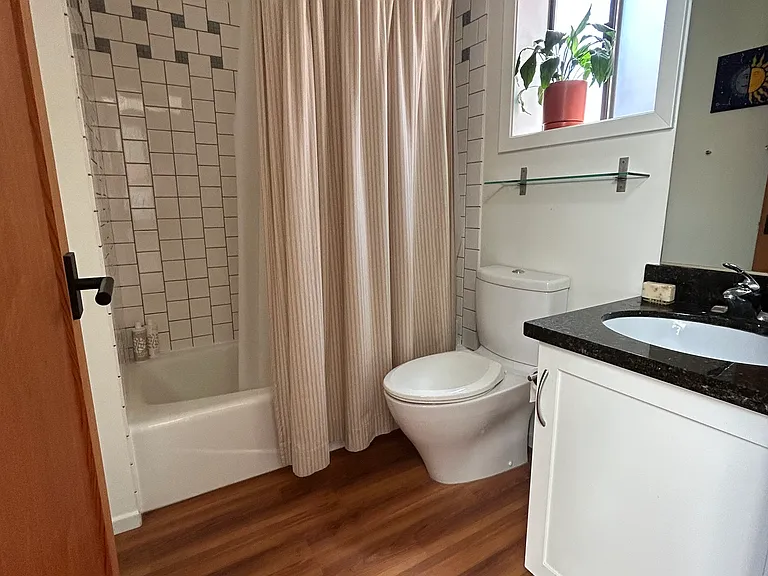 Bathroom with tub and shower off the second bedroom