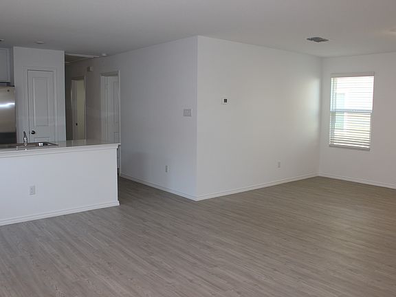 As you walk in you see kitchen, eating area and living room.