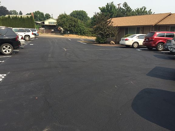 Duplex is behind white car