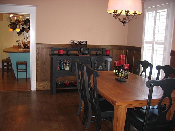 Elegant separate dining room and just a glimpse of a spacious kitchen 