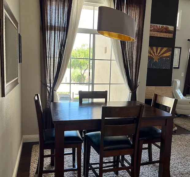Dining Room table has a leave that opens to seat 6.
