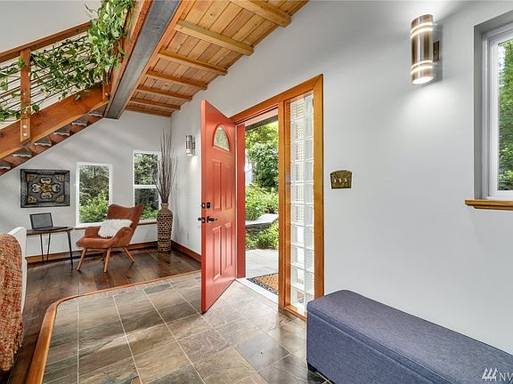 Lovely covered porch area leads into welcoming slate entry.