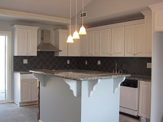 Kitchen features newer cabinets and granite counter tops!!