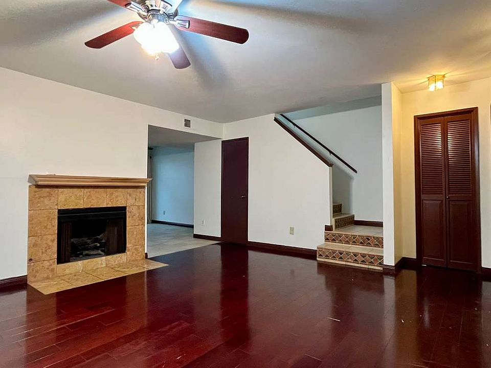 Living room, Italian marble fireplace, stairwell bottom, utility closet, Brazilian rosewood floors