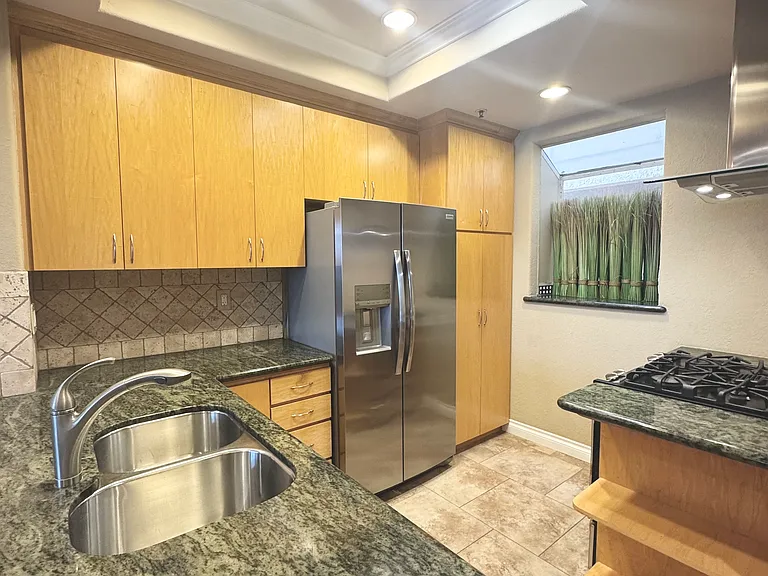 Stone flooring and backsplash, granite counters