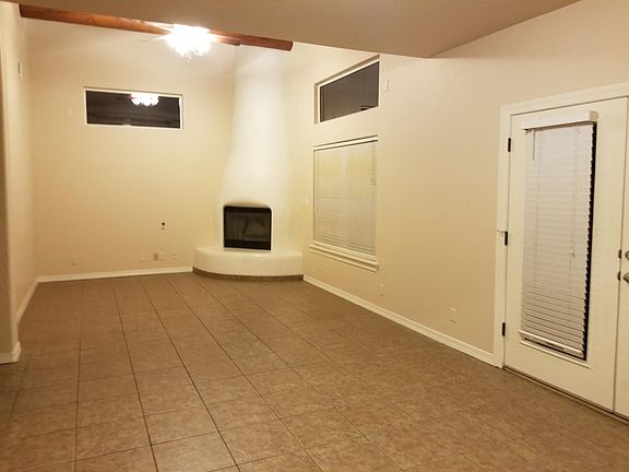 Living/dining area with french doors to patio.