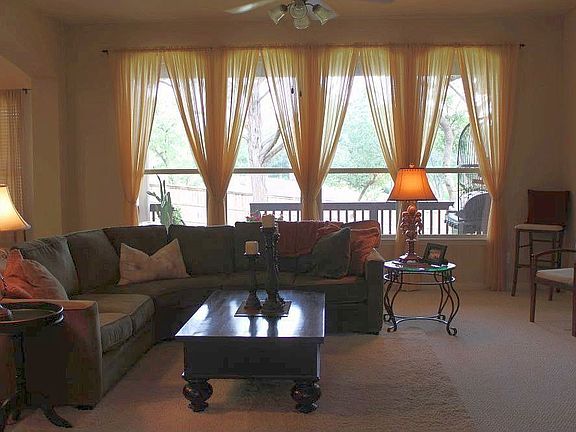 Great room with wall of windows overlooking spacious backyard...