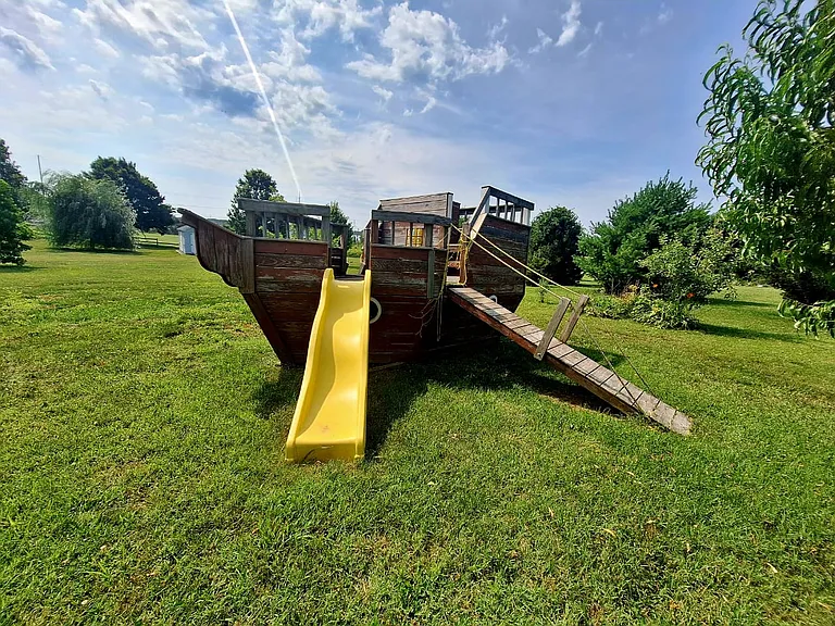 Kids will love the backyard pirate ship playground, offering plenty of space for outdoor fun during longer stays.