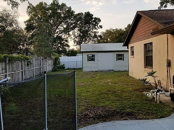 Large fenced yard and shed