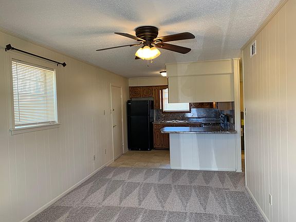 Curtain rods and blinds included throughout. Side entrance with nice yard and screen door.