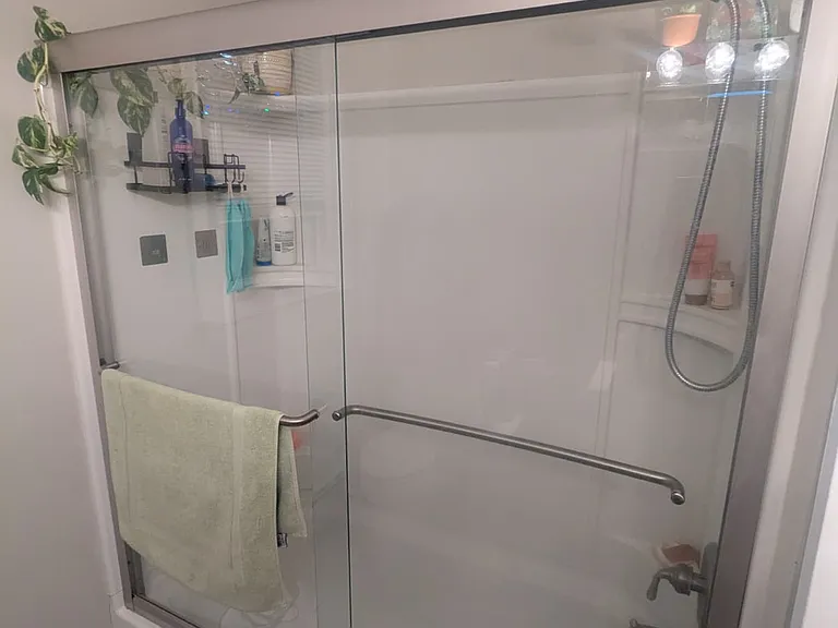 High end bath with glass enclosure