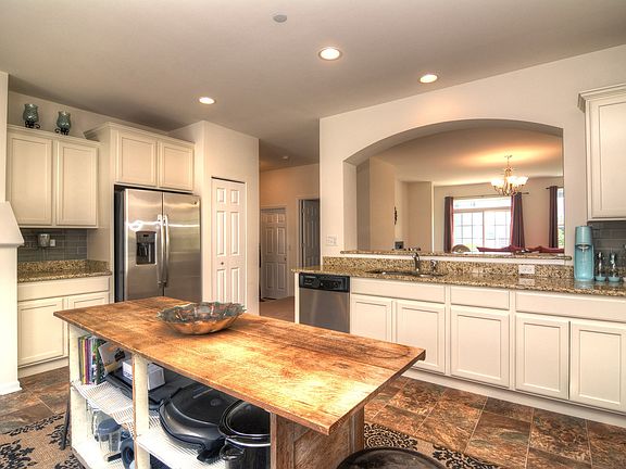 Gourmet Kitchen with Recessed Lighting and Pantry