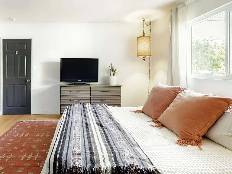 bedroom 2 - oversized closet doors painted dark blue (king size bed)