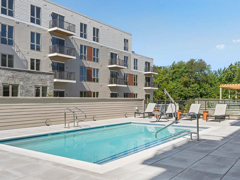 Resort-style pool with sundeck and chaise lounges.