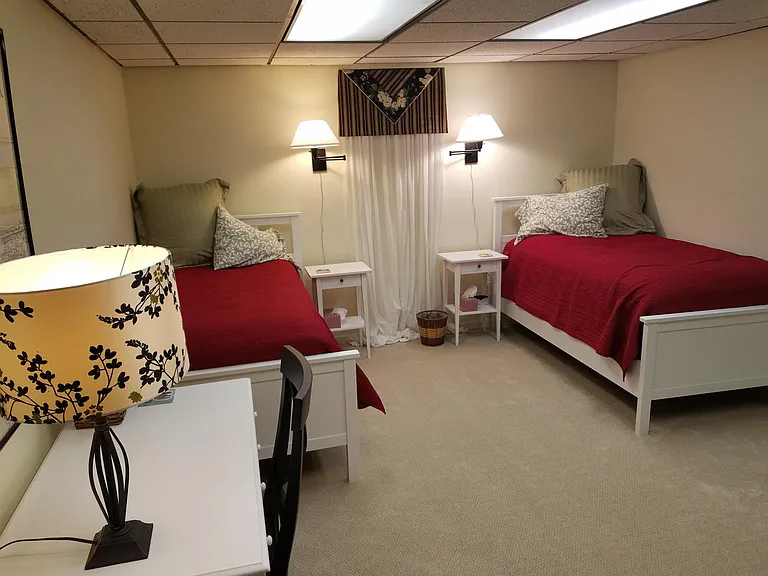 basement bedroom (non-conforming) with 2 extra long twins that can be combined into a king bed