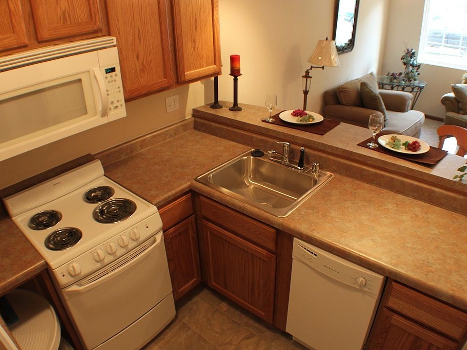 The open concept kitchen, complete with a breakfast bar that