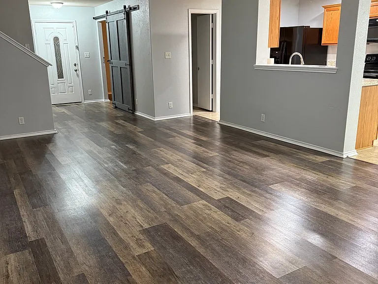 Living room overlooking kitchen dining room, powder bathroom