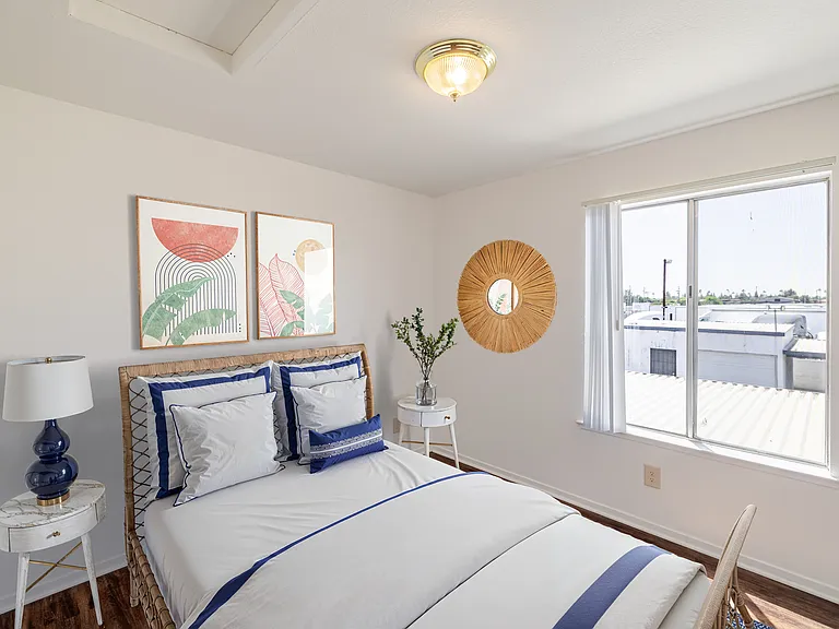 Bedroom #2 with bright windows and an inviting, airy ambiance.