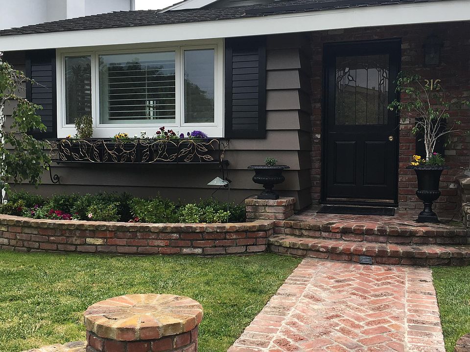 Front of house - entry to top floor bungalow is up the side lighted walk