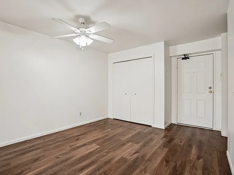 Welcoming entryways feature wood flooring and convenient closet storage for everyday essentials, professionally operated by Highlands Vista Group.