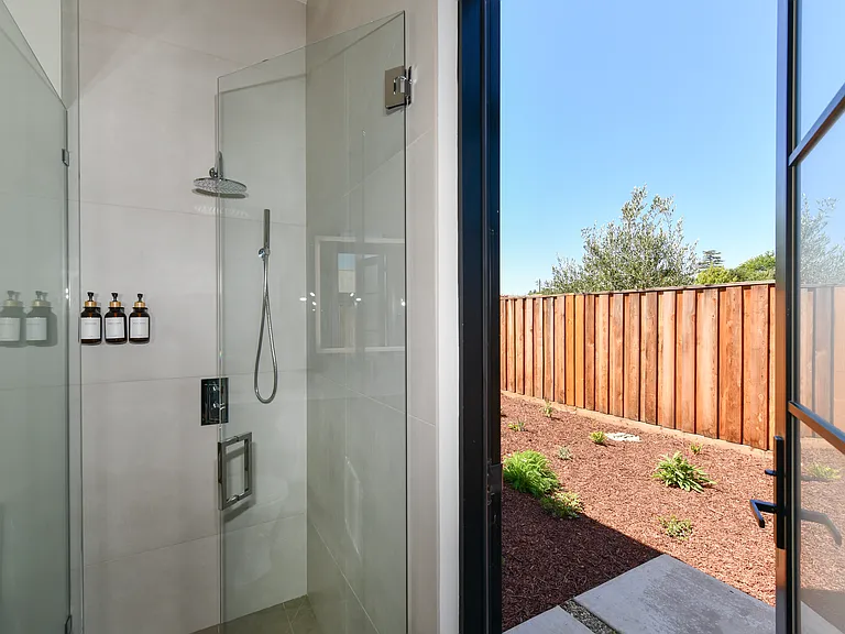 Bathrooms have doors to private gated yard.