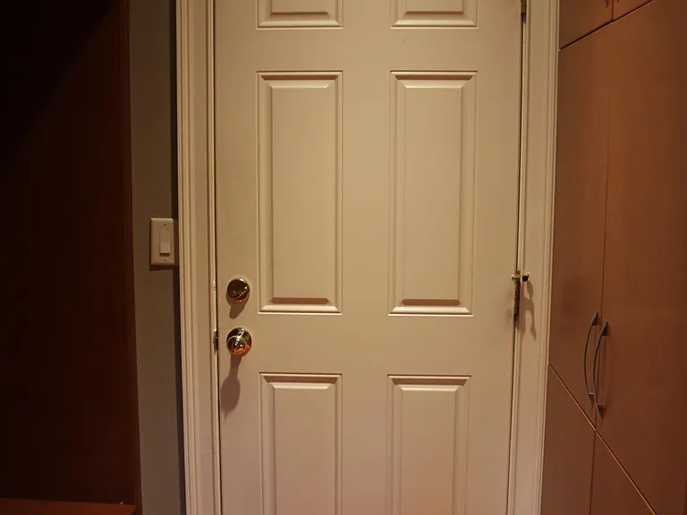 Ample storage and mudroom space leads to garage.