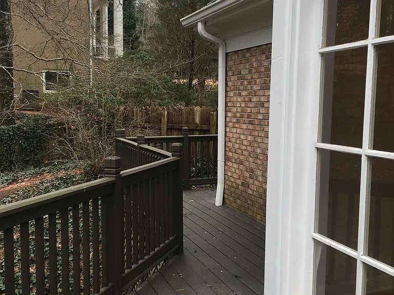 Deck leading to secure fence gate