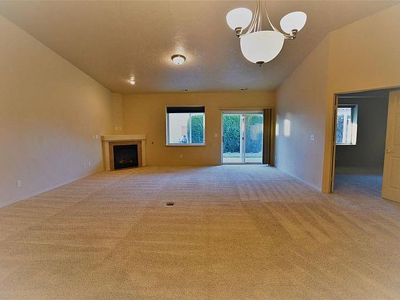 living room. The door on the right leads to master bedroom.