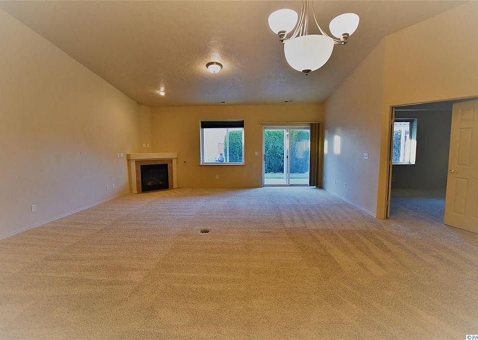 living room. The door on the right leads to master bedroom.
