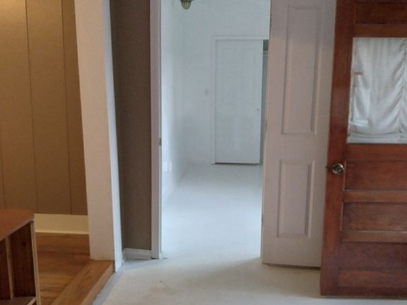 Entry room looking back toward front door, front bedroom.