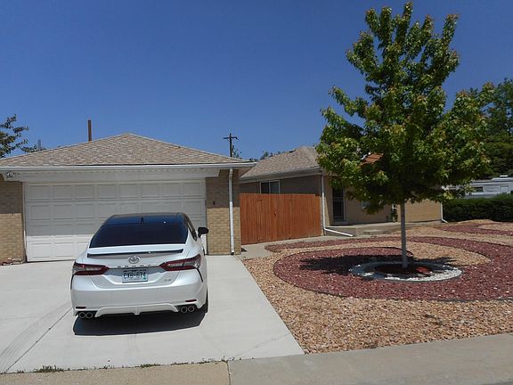 2 stall detached garage with steel security door. Low maintenance front yard. Weeds sprayed at owners expense,
