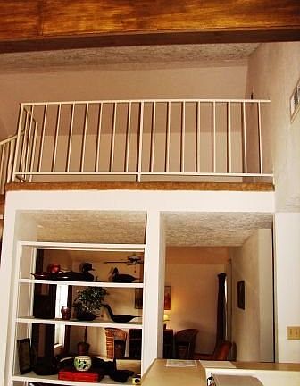 Upstaris loft area that can be used as an office of play area