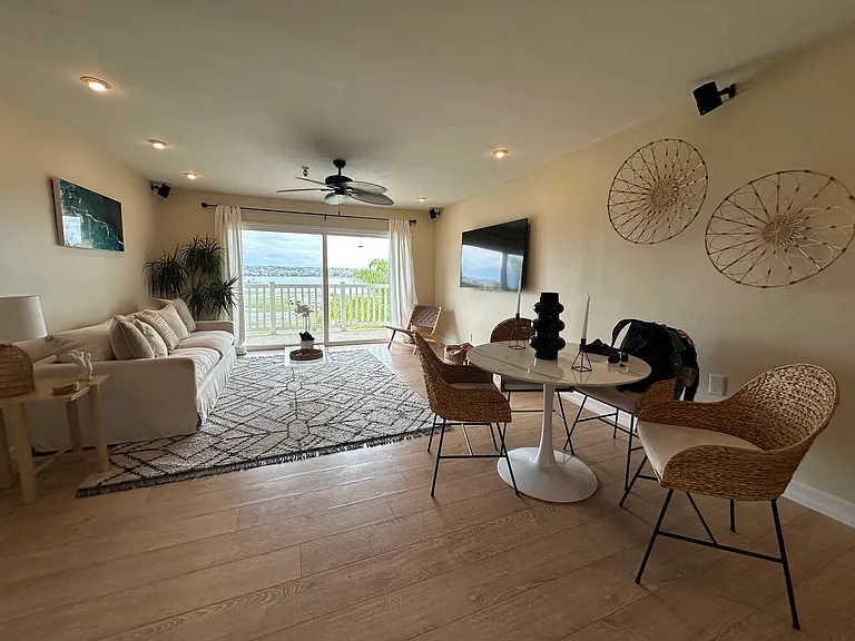 Living Room tastefully furnished with panoramic bay and fire works views