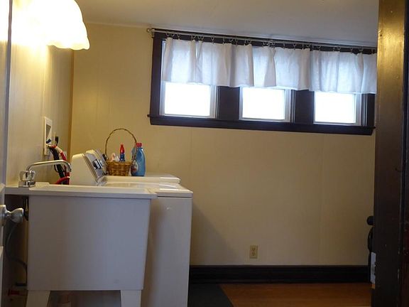 This apartment has its own laundry room right off of the kitchen.