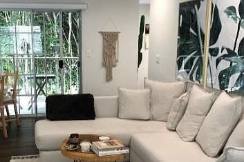 Living room and downstairs private balcony