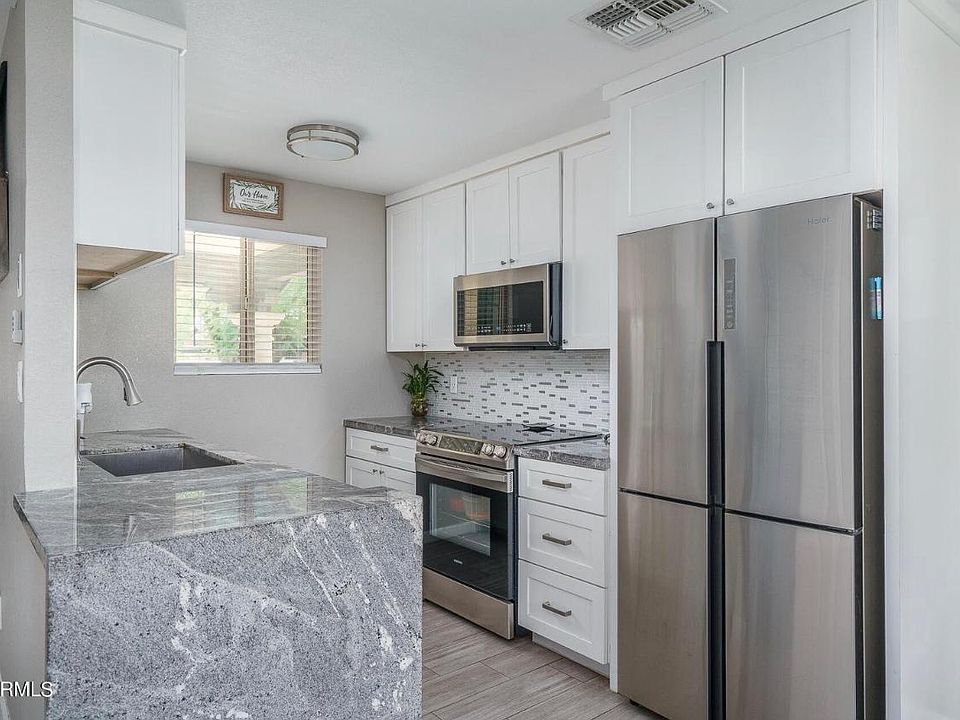 Beautiful Gourmet Kitchen with granite, backsplash, extended cabinets and farm style sink.