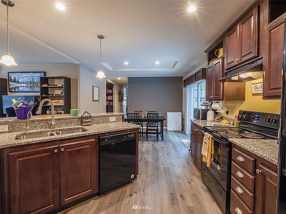 Another view of your kitchen showing the dining room and partial view of the living room. Great open floor plan, perfect for entertaining. 