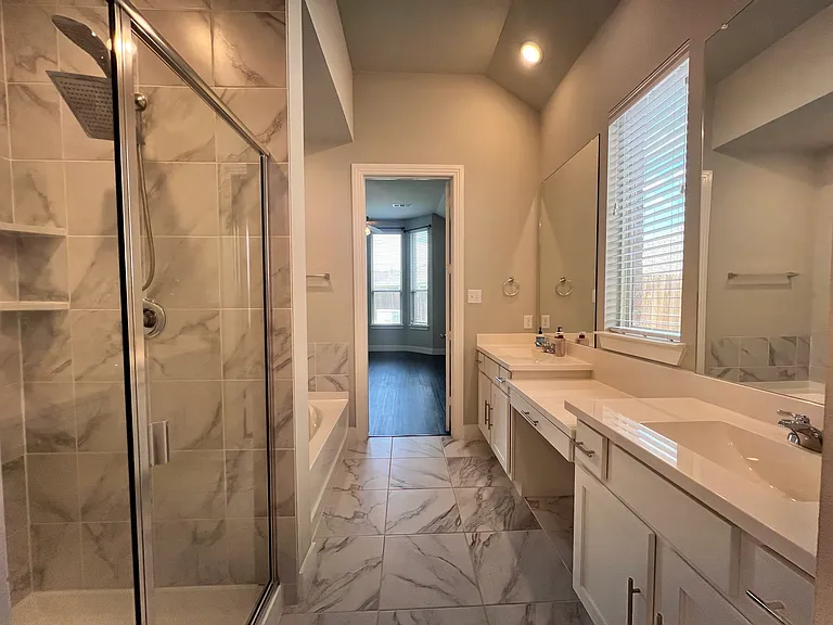 Primary bathroom. Tub and a separate shower.