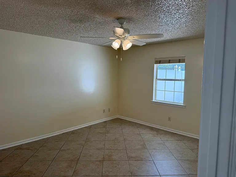 Master bedroom window faces the private fully fenced rear patio.